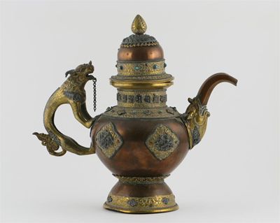 Appraisal: A Tibetan copper ewer and cover the spout emerging from