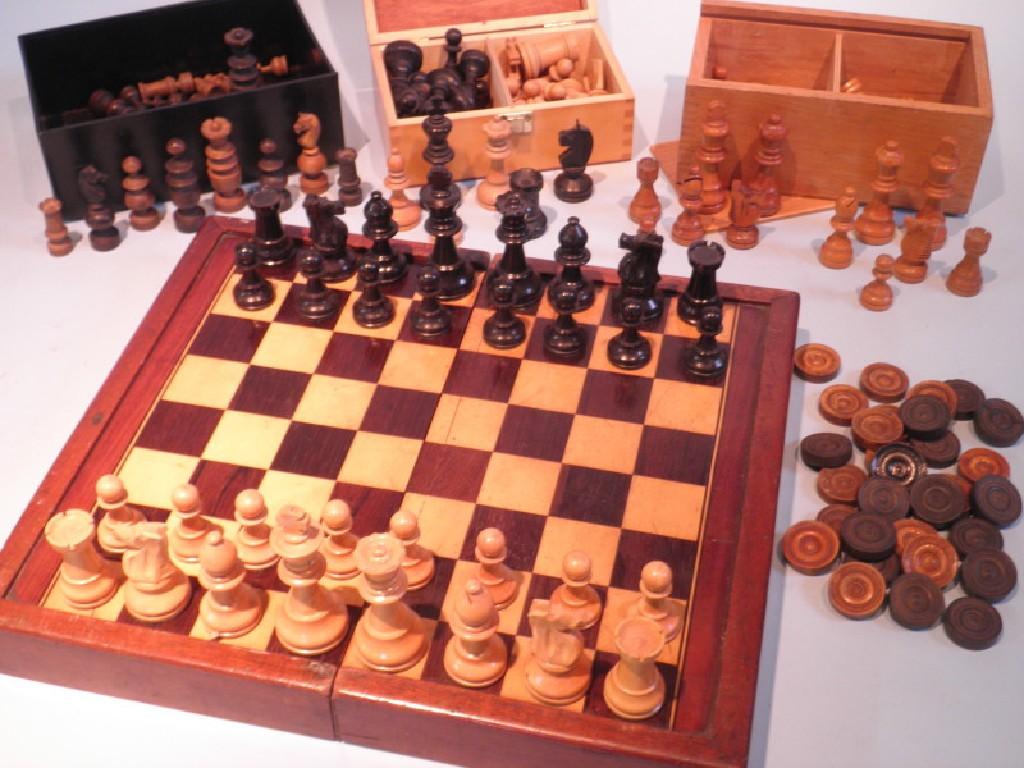 Appraisal: A mahogany inlaid chess board and three sets of chess