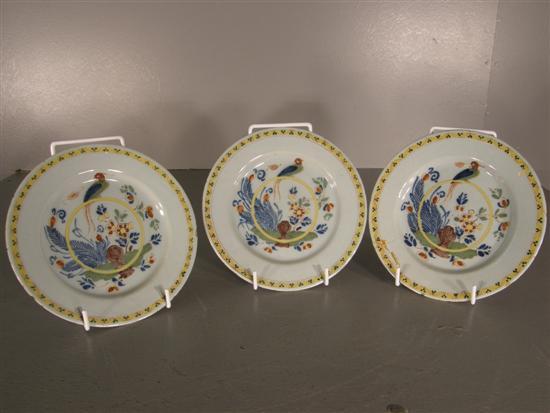 Appraisal: Three Delft plates th century painted in colours with a