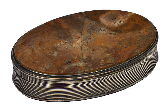 Appraisal: A GEORGE IV OVAL SILVER AND HARDSTONE SET SNUFF BOX