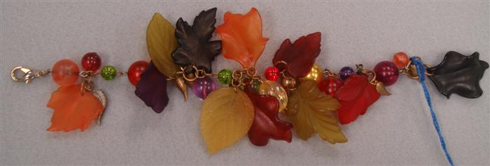 Appraisal: Multi-colored plastic leaves and balls bracelet Estimate -