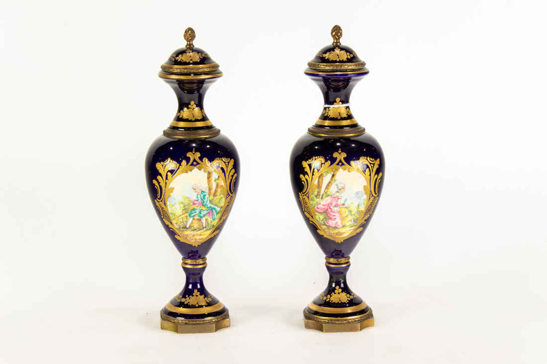 Appraisal: PAIR OF SEVRES STYLE GILT BRONZE MOUNTED EARTHENWARE COVERED URNS