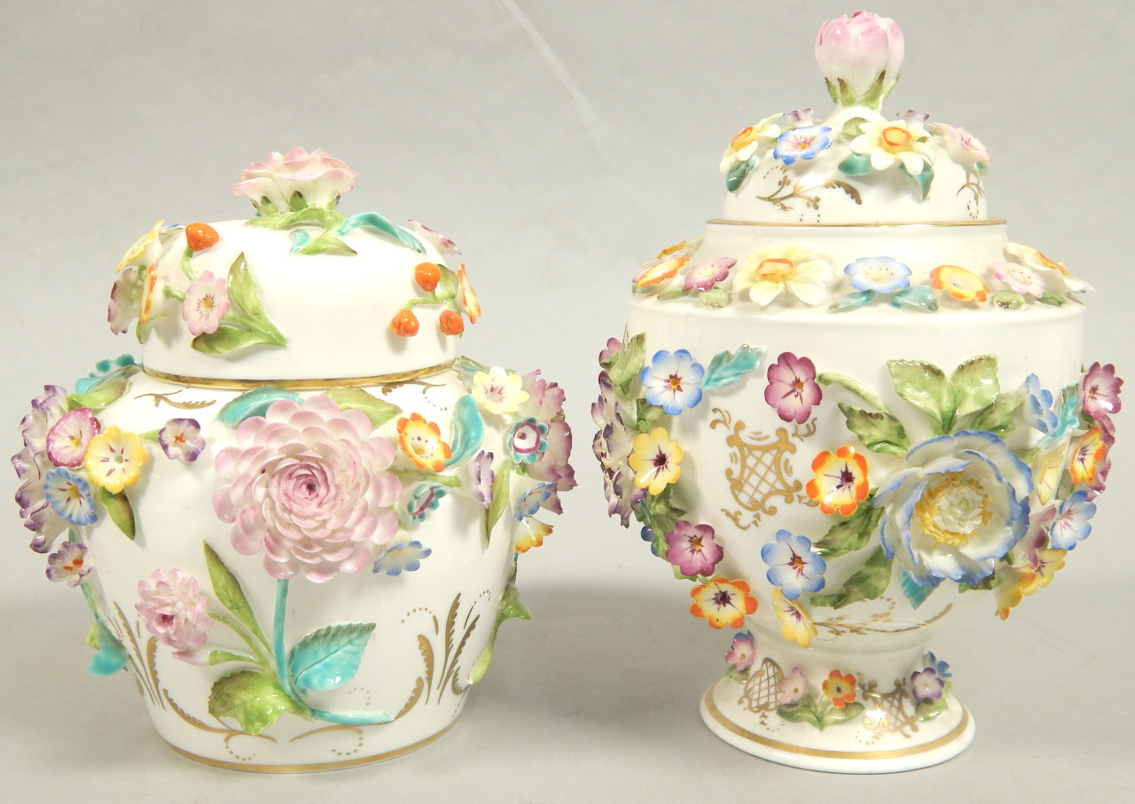 Appraisal: Two similar Coalport Coalbrookedale type flower encrusted vases and covers