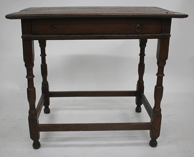 Appraisal: AN ANTIQUE OAK SIDE TABLE the single frieze drawer with