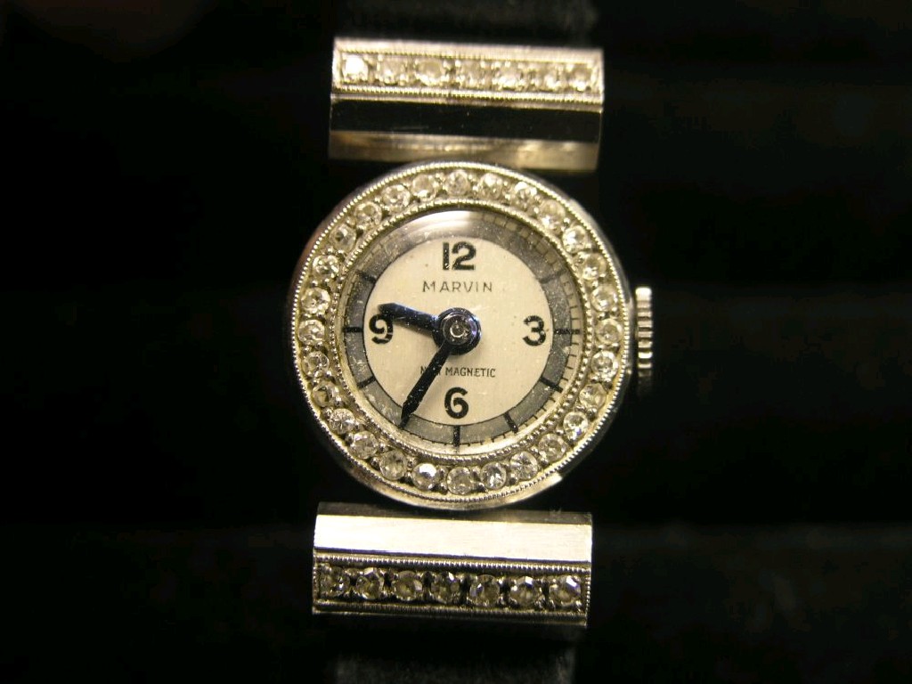 Appraisal: A lady's Marvin platinum and diamond cocktail watch the shoulders