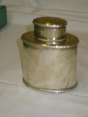 Appraisal: A VICTORIAN TEA CADDY of oval bottle form the lid