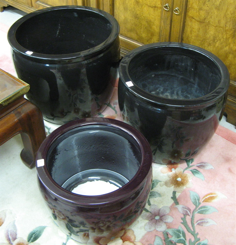 Appraisal: THREE GLAZED POTTERY PLANTERS of circular jar form in three