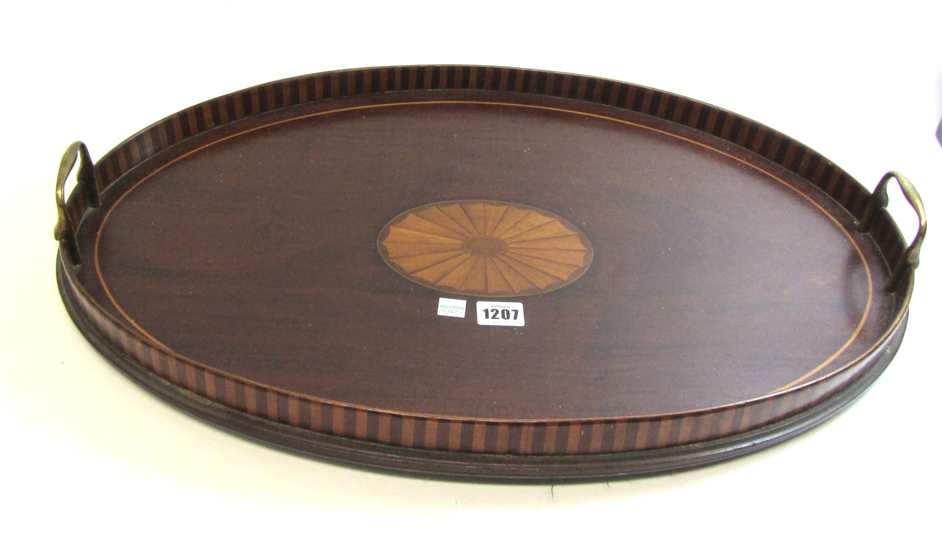 Appraisal: An Edwardian inlaid oval galleried serving tray with brass loop