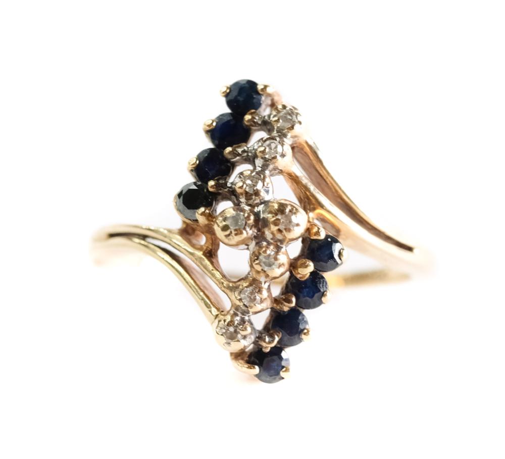 Appraisal: k yellow gold ctw sapphire and ctw diamond ring size