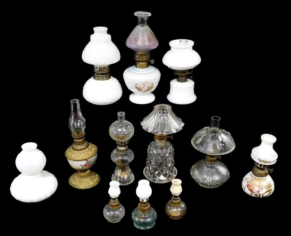 Appraisal: Miniature oil lamps all with white or clear fonts and