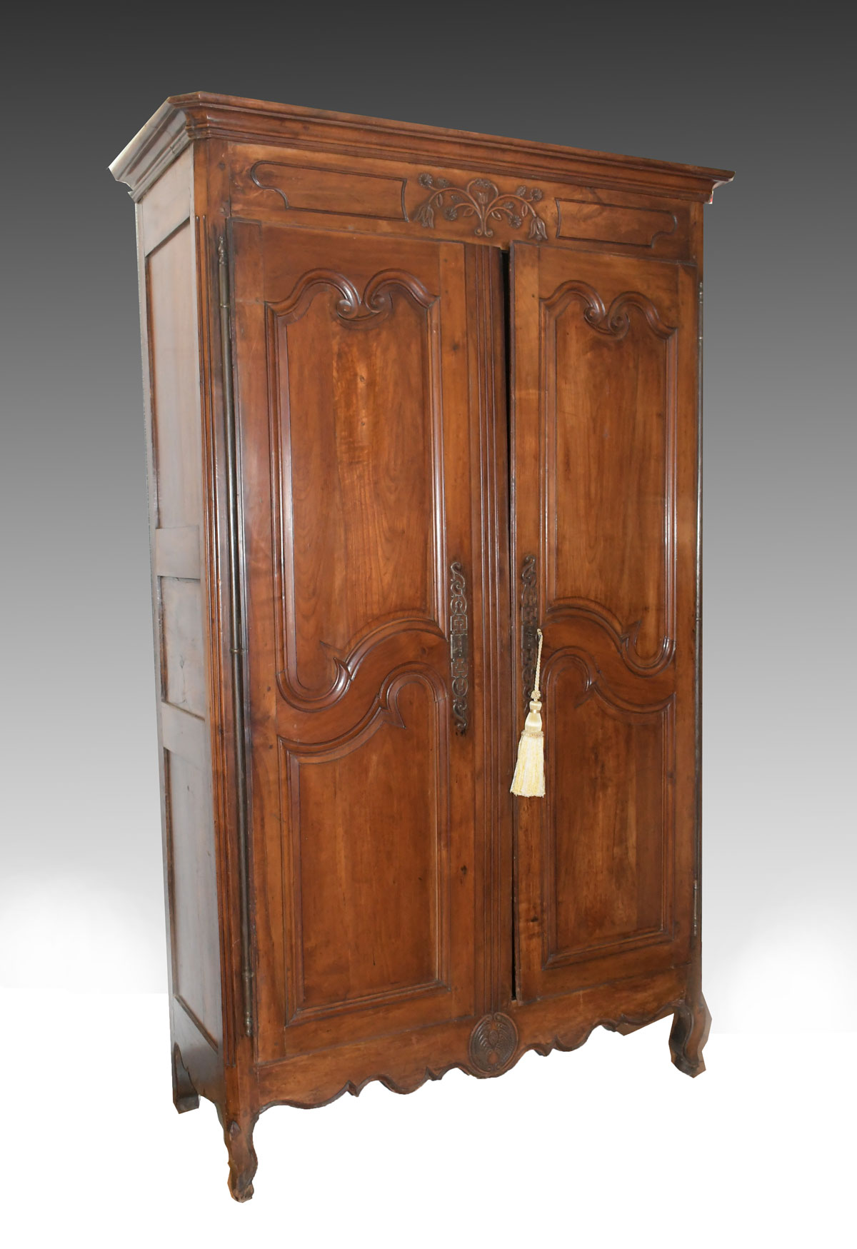 Appraisal: TALL CARVED FRENCH COUNTRY CABINET Carved door cabinet having scrolling