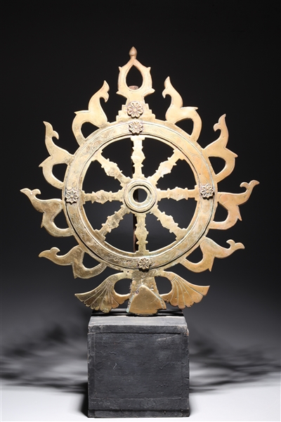 Appraisal: Antique Indian gilt metal Dharma chakra wheel sculpture with incised