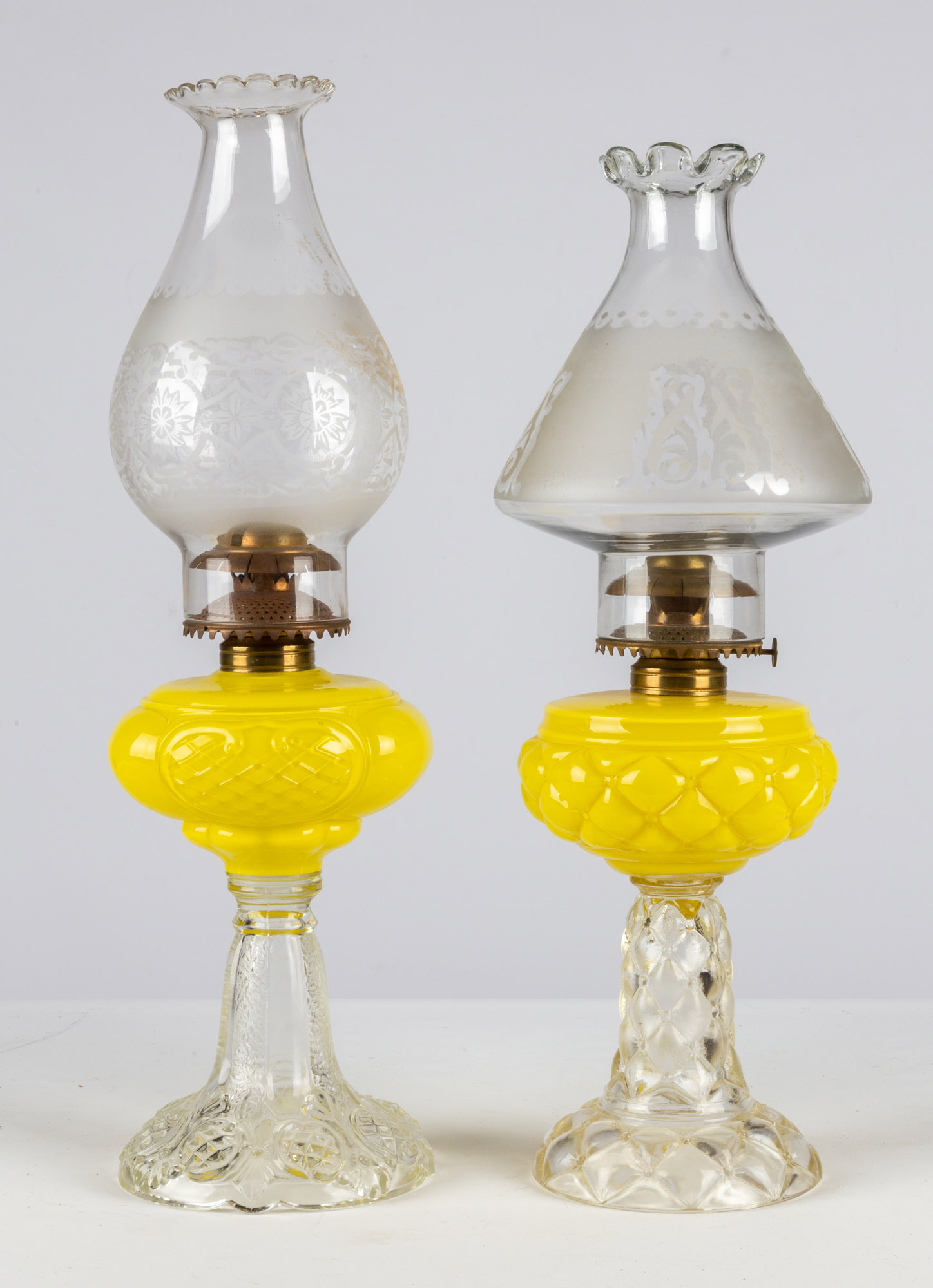 Appraisal: YELLOW QUILT PRINCE EDWARD OIL LAMPS circa period burners and