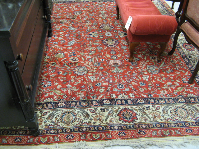 Appraisal: HAND KNOTTED ORIENTAL CARPET Indo-Persian overall floral decoration on red