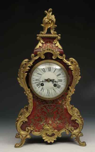 Appraisal: A FRENCH BOULLE TORTOISE SHELL AND BRASS INLAID MANTEL CLOCK