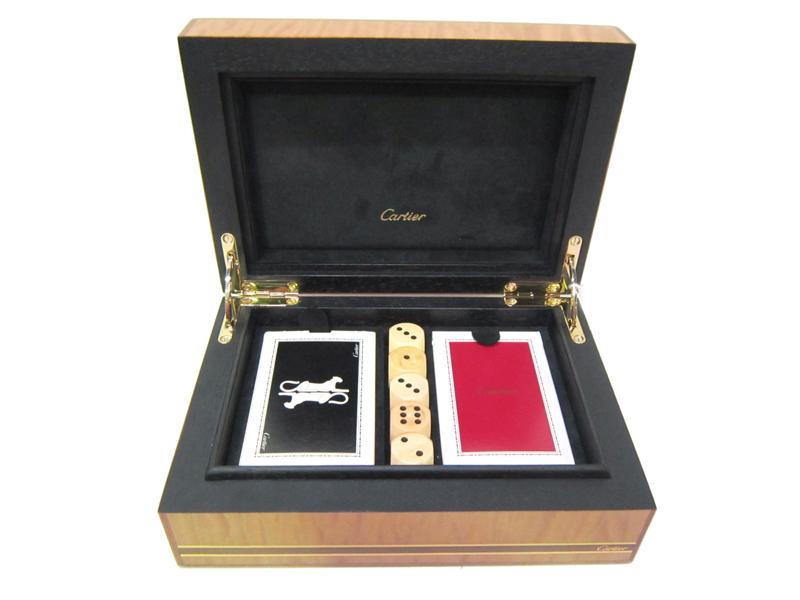 Appraisal: A SET OF CARTIER PLAYING CARDS IN A FIGURED WOOD