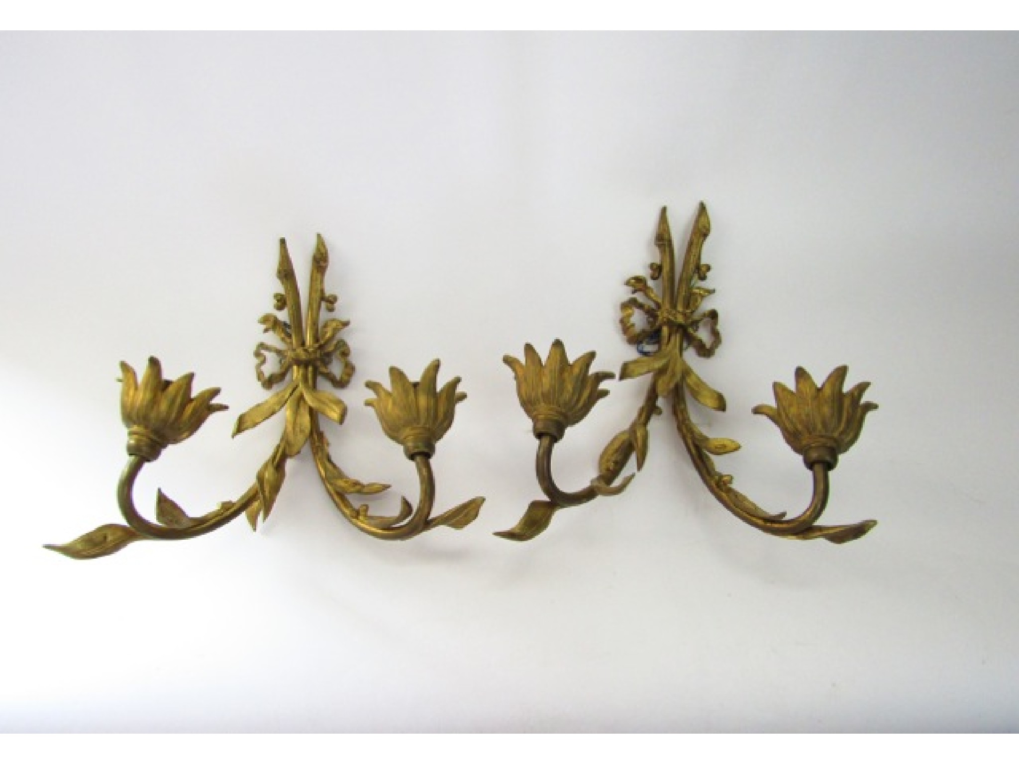 Appraisal: Lighting A pair of ormolu cast metal two divisional wall