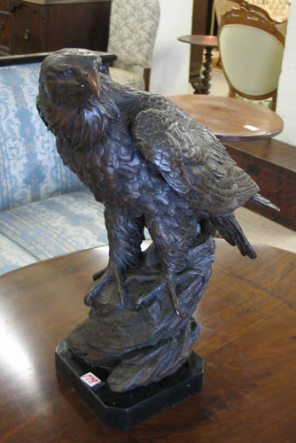 Appraisal: BRONZE SCULPTURE of an American bald eagle having brown patination