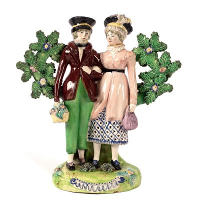 Appraisal: An English pearlware figure group 'The Dandies' or 'Dandy and