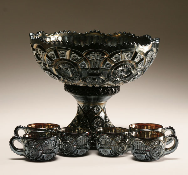 Appraisal: Carnival glass punch bowl with matching cups the body decorated