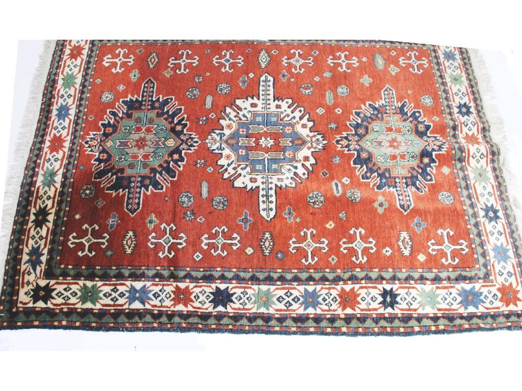 Appraisal: EASTERN RUG OF CAUCASIAN STYLE with three large winged medallions