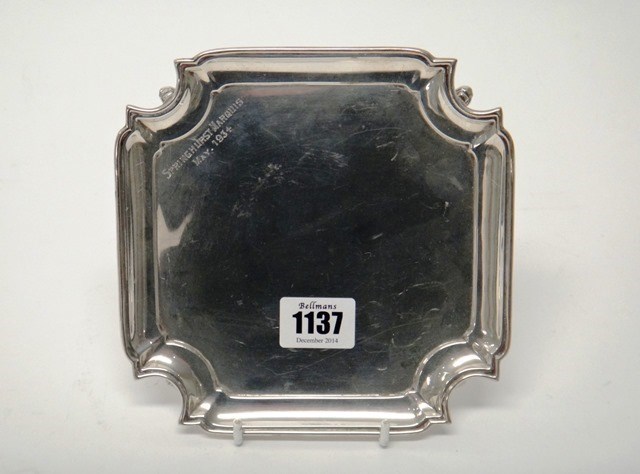 Appraisal: A silver waiter of shaped square form having curved corners