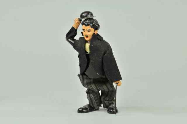 Appraisal: CHARLIE CHAPLIN TOY Possibly German mfg hand painted tin figure