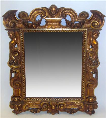 Appraisal: Louis XIV style carved giltwood mirrorThe rectangular plate within an