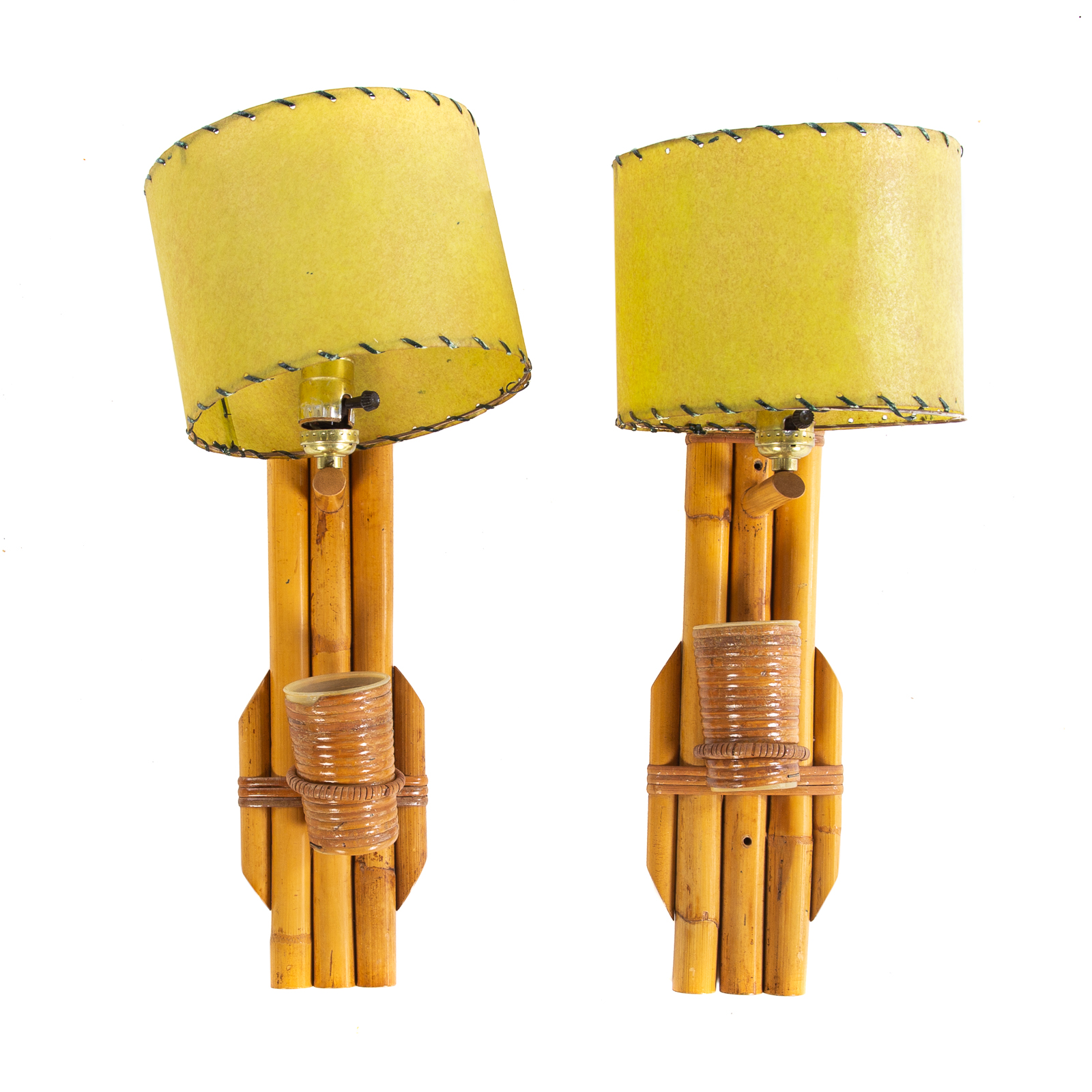 Appraisal: A PAIR OF PAUL FRANKL STYLE TIKI WALL SCONCES Mid-century