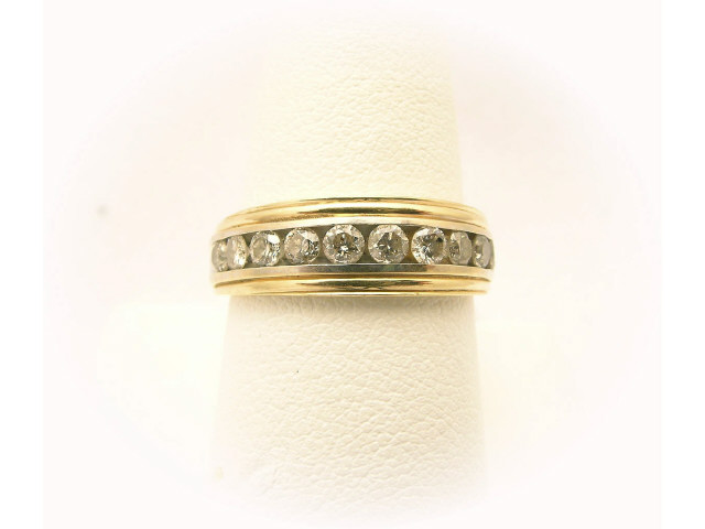 Appraisal: K two-tone gold gentleman's band with eleven round brilliant diamonds