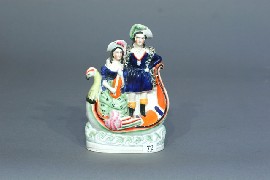 Appraisal: A Staffordshire figure of musicians cm