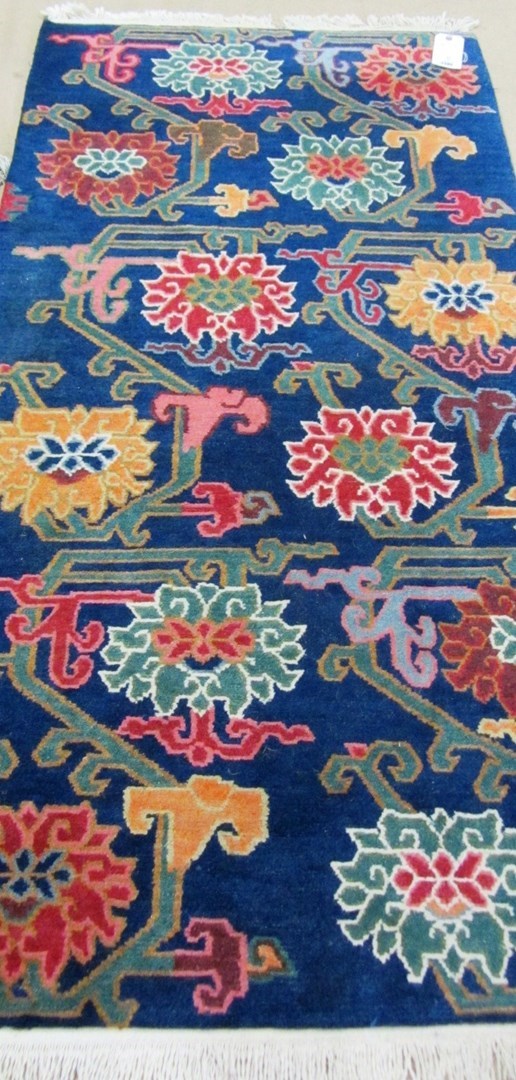 Appraisal: A Tibetan rug the indigo field with angular sprays of