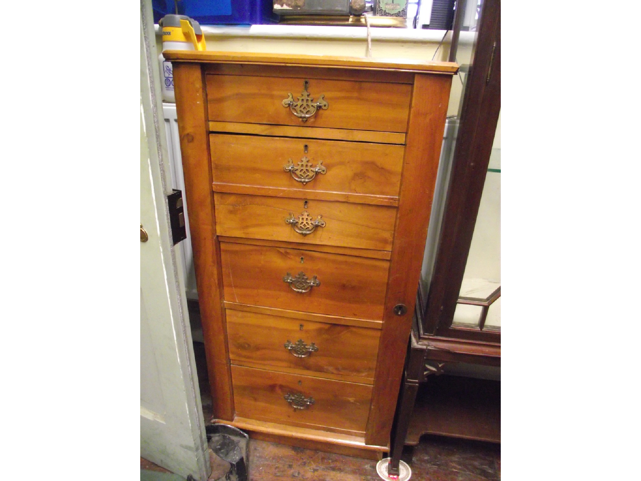 Appraisal: An Edwardian soft wood wellington chest the front elevation enclosed