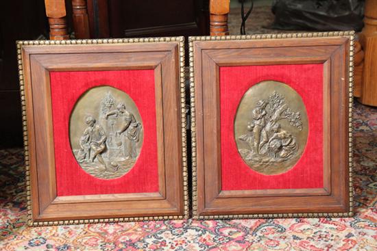 Appraisal: TWO FRAMED PLAQUES Bronze plaques with embossed classical scenes red