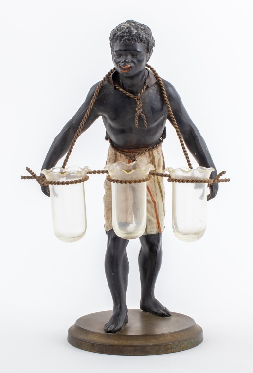 Appraisal: POLYCHROMED FIGURE OF A BLACKAMOOR FLOWER SELLER Polychromed spelter figure