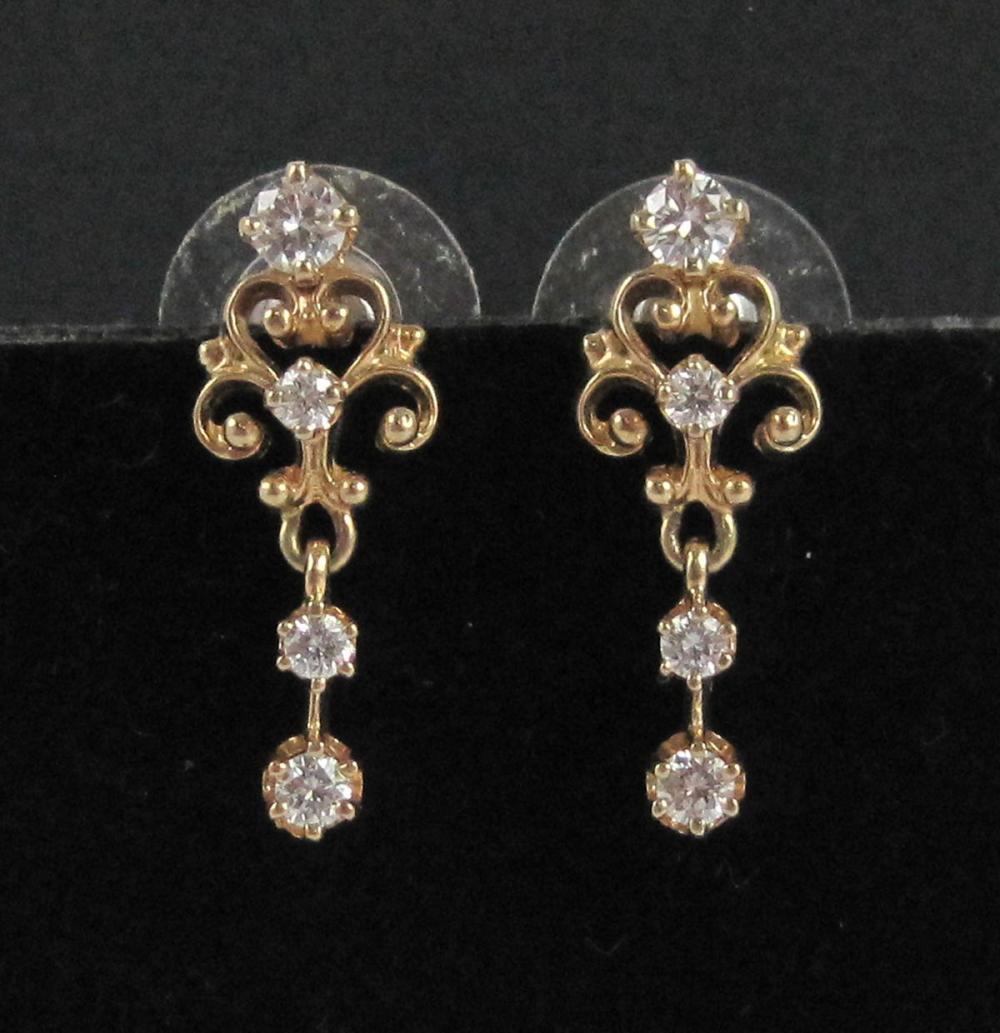 Appraisal: PAIR OF DIAMOND AND FOURTEEN KARAT GOLD EARRINGS each dangle