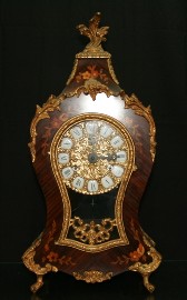 Appraisal: A German brass-mounted marquetry mantle clock cm high