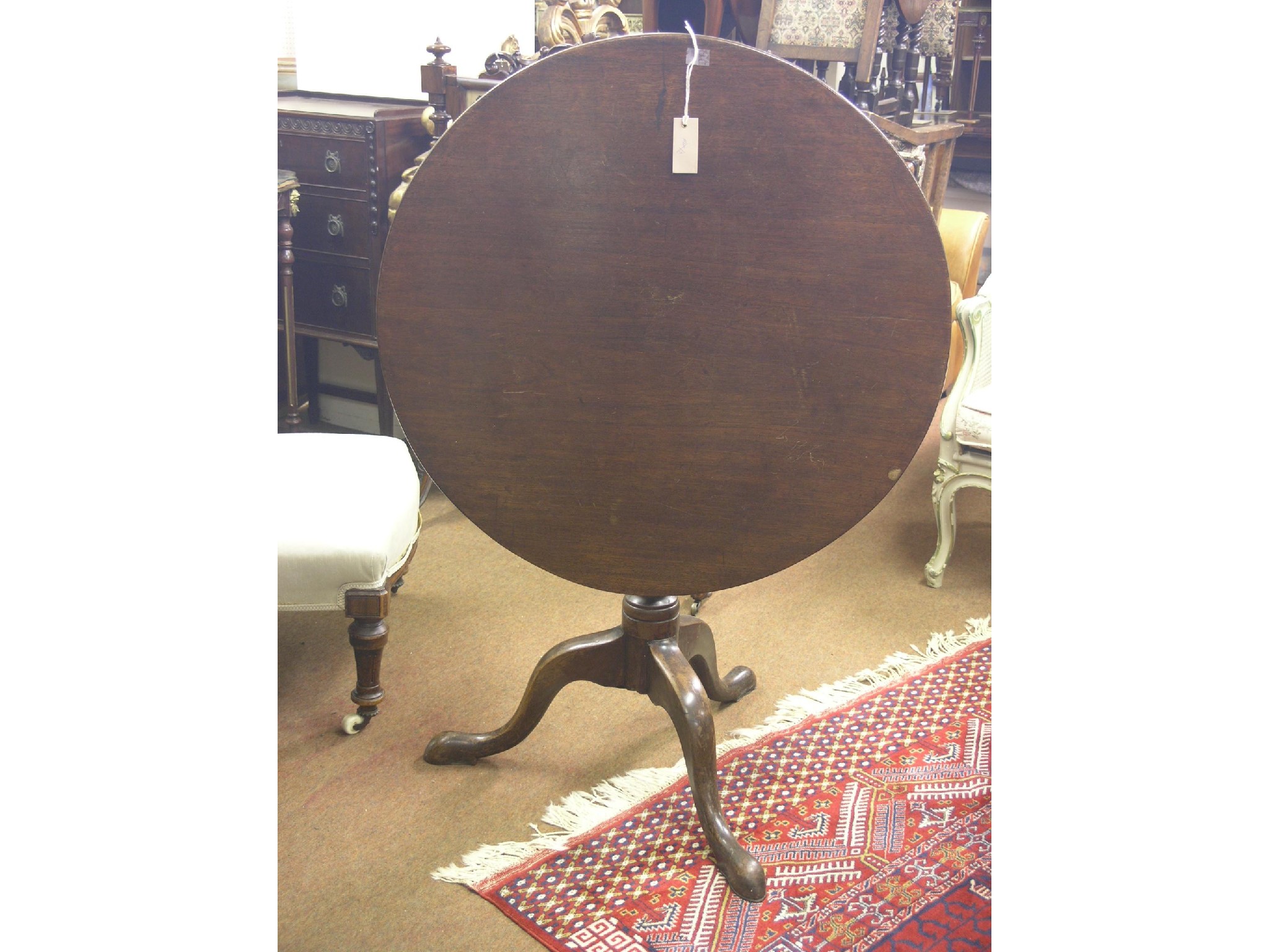 Appraisal: A George III mahogany tilt-top table circular top on urn-shape