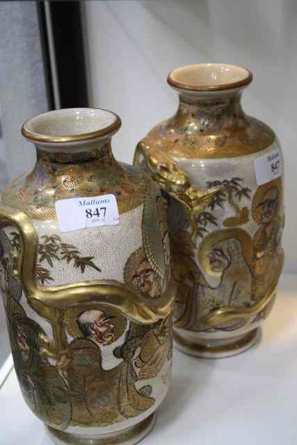 Appraisal: A PAIR OF JAPANESE SATSUMA WARE VASES decorated with figures