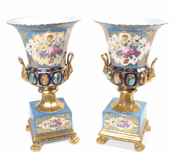 Appraisal: A pair of porcelain campana form urns height in diameter