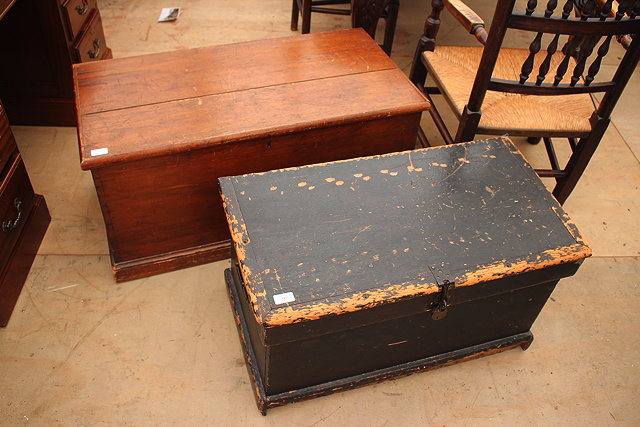 Appraisal: A VICTORIAN PINE BLANKET BOX with iron carrying handles to