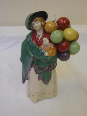 Appraisal: A ROYAL DOULTON POTTERY FIGURE modelled as the Balloon Seller