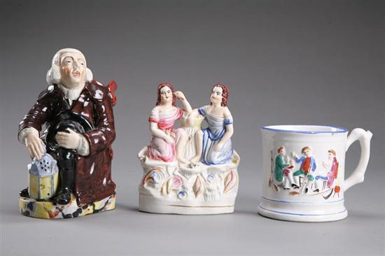 Appraisal: TWO STAFFORDSHIRE FIGURES AND A MUG England mid th century