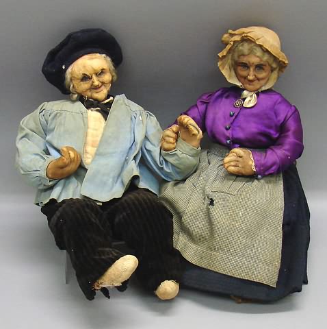 Appraisal: Pair of elderly Ravca dolls Man and woman sitting together