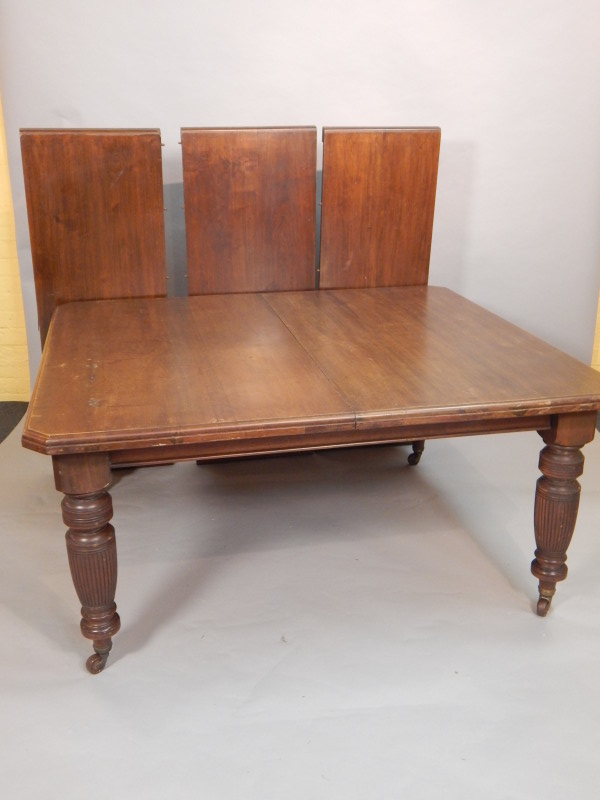 Appraisal: A large Victorian walnut extending dining table the rectangular top