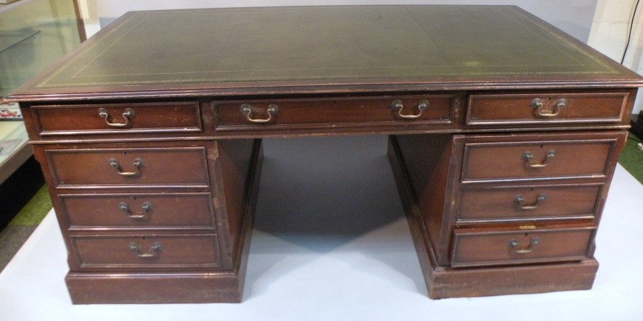 Appraisal: A thC mahogany partner's desk the rectangular moulded top with