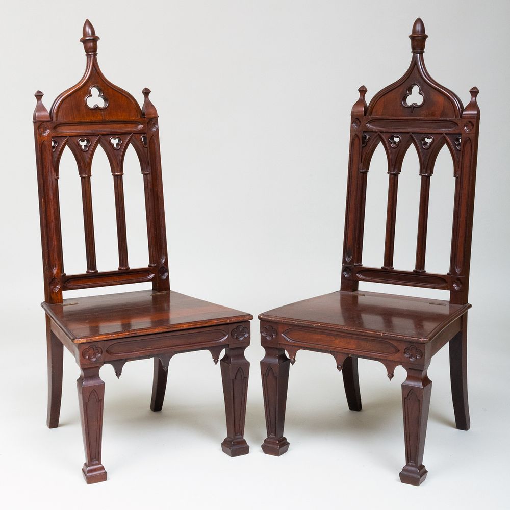 Appraisal: Pair of Victorian Neo-Gothic Carved Rosewood Hall Chairs Fitted with