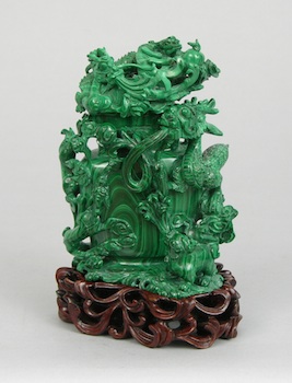 Appraisal: An Elaborately Carved Malachite Vase with Cover The vase is