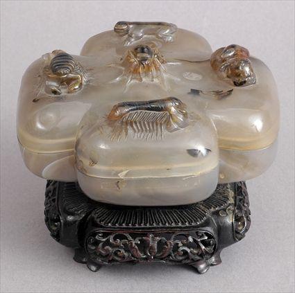 Appraisal: CHINESE CARVED AGATE QUATREFOIL FOOTED BOX AND COVER The cover