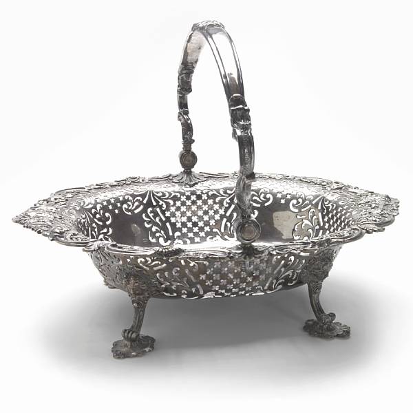 Appraisal: A George II silver cake basketHenry Baily London Of shaped